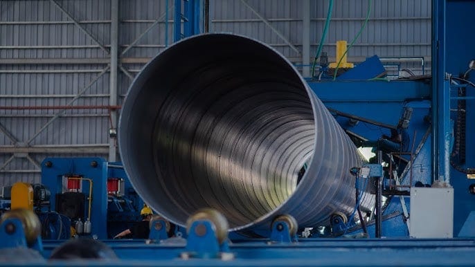 Spiral (SSAW) pipe being formed on the mill line